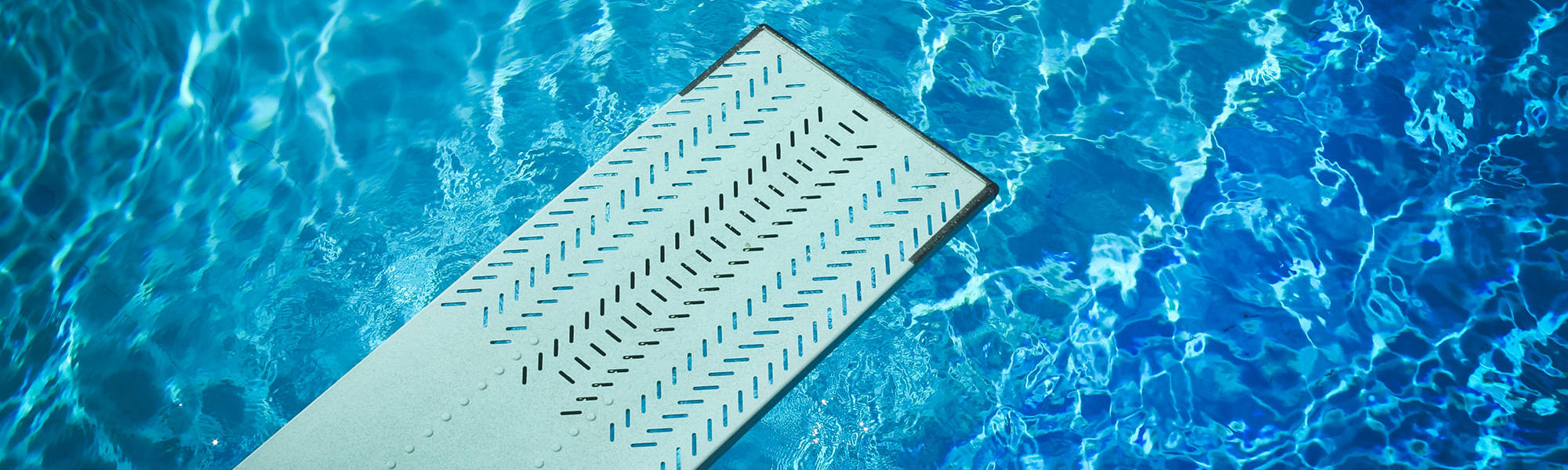 diving board over an empty pool